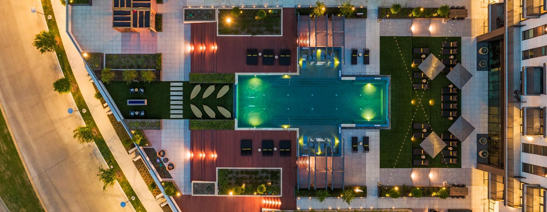 aerial view of a building complex with a pool