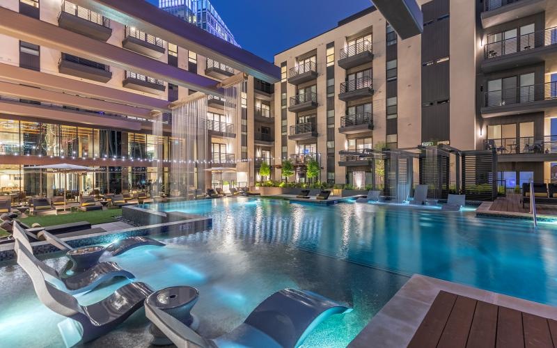 a pool in a courtyard between buildings
